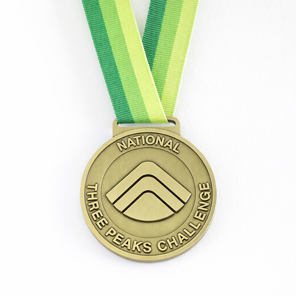 Front of the National Three Peaks Challenge Medal