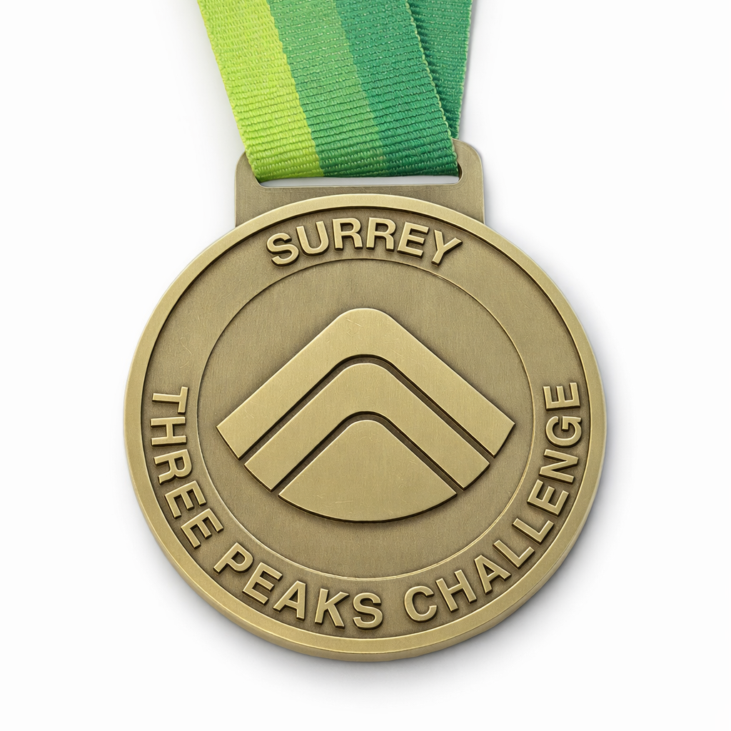 Front of the Surrey Three Peaks Challenge Medal