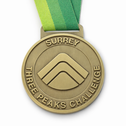 Front of the Surrey Three Peaks Challenge Medal