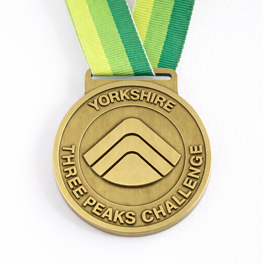 Front of the Yorkshire Three Peaks Challenge medal.